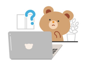 パソコンに向かいながら疑問に思うクマのイラスト